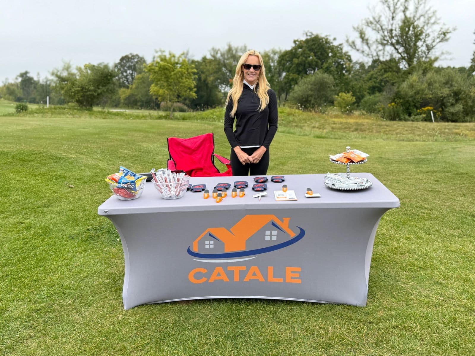 A sponsor table set up on the course at the SEWI Claims golf outing